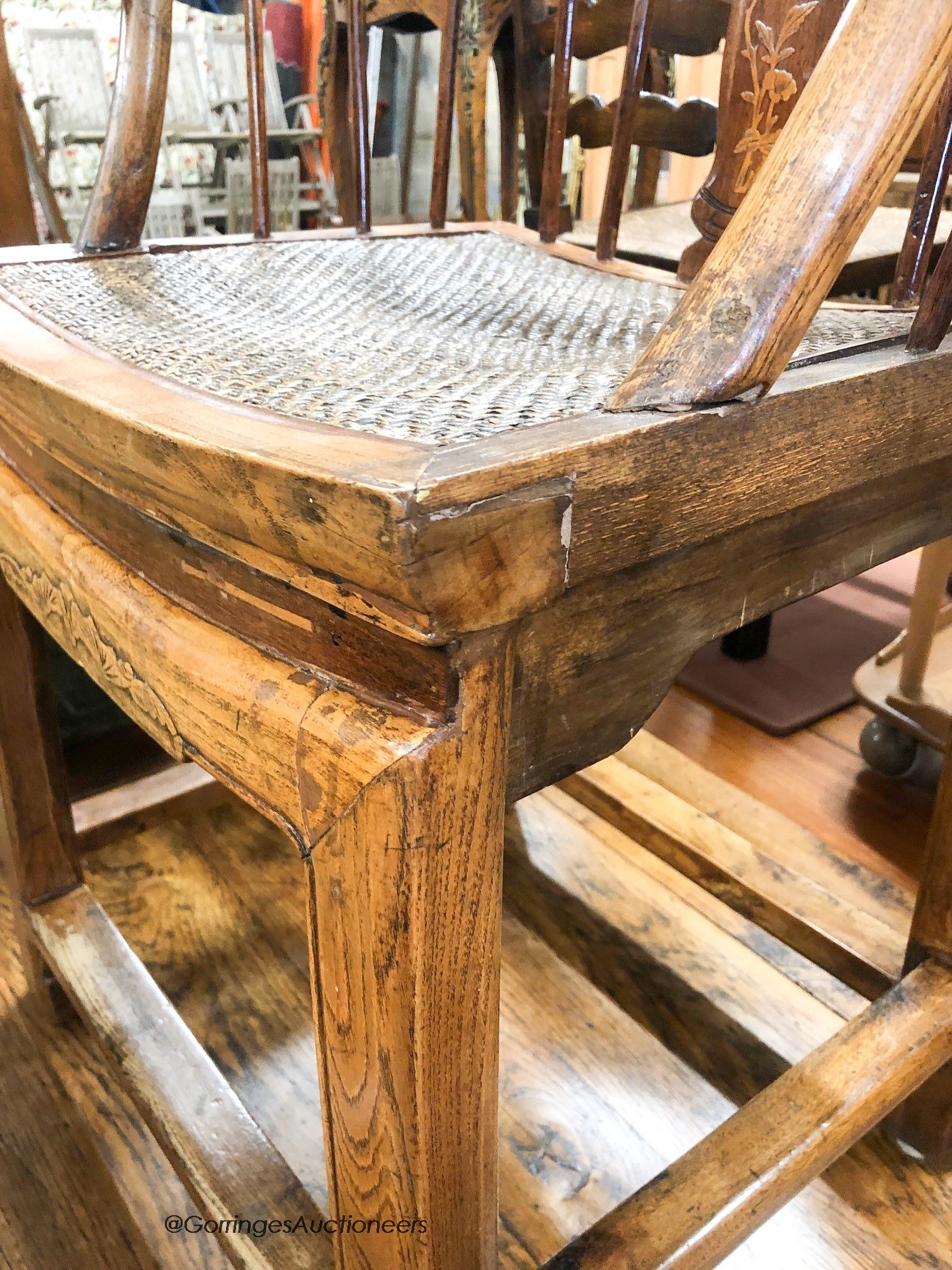 A Chinese elm stickback elbow chair, width 62cm, depth 42cm, height 86cm